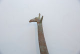 Sculpted head and neck of a vintage African giraffe with an oxidized metal patina.