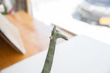 Close-up of vintage African giraffe head, showcasing its time-softened green patina.