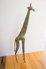 Collectible vintage African giraffe figure with rich green-bronze patina.