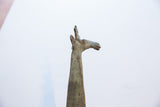 Vintage African giraffe figurine head, showing greenish-brown patina.