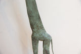 Textured green oxidized finish on the body and slender neck of the vintage giraffe.