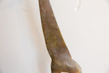 Close-up of the hand-etched patterns on the vintage giraffe's aged brown neck.
