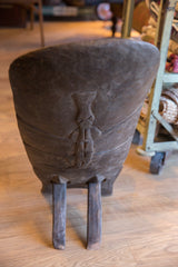 Hand-carved animal motif on the back of the vintage African wooden slot chair.