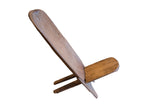 Vintage African wooden slot chair showing its minimalist two-piece interlocking construction.