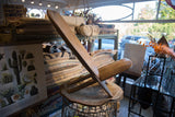 Vintage wooden slot chair highlighting its sculptural, interlocking form.