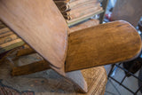 Angled detail of the vintage African slot chair's interlocking wood construction.