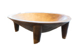 Vintage hand carved Senufo wooden bowl on legs, dark brown and warm interior.