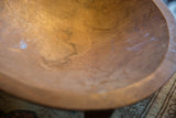 Close-up of the vintage hand carved African bowl's interior, showing warm wood grain and texture.