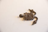 Close-up of the vintage African turtle pendant, highlighting its textured body and detailed head.