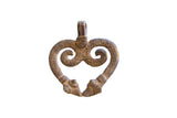 Symmetrical vintage double snake pendant with a textured, time-worn bronze patina.