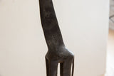 Close-up of the hand-sculpted texture and dark patina on the vintage giraffe's neck.