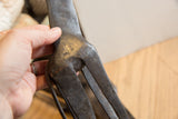 Hand-worked metal and dark, textured patina of the vintage African giraffe.