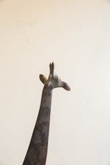 Close-up of the vintage African giraffe's sculpted head and long neck.