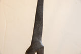Dark, textured hand-carved detail on the body of the vintage African giraffe.