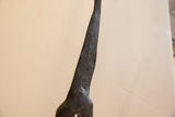 Textured surface detail with etched patterns on the neck of the vintage giraffe.