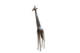 Large vintage African giraffe sculpture with a stylized form and dark, textured finish.