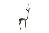 Medium vintage African gazelle sculpture with a stylized, elongated form and dark patina.