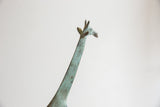 Vintage African giraffe's head and neck with mottled verdigris patina.