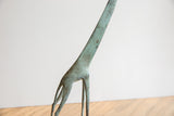 Vintage African giraffe's legs and lower neck with detailed green patina.