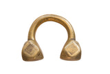 Antique African Tuareg bronze cuff with a warm gold patina and geometric incised ends.