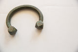 Textured band and geometric ends of an antique oxidized copper alloy snake cuff.