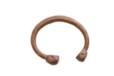 Antique African copper alloy snake cuff bracelet with etched geometric patterns and stylized ends.