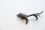 Dark, textured metallic vintage African lion head and body, circa 1960s.