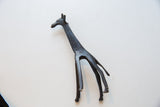 Vintage dark bronze African giraffe head and neck with etched patterns.