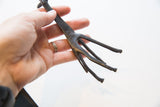 Vintage dark bronze giraffe legs with textured lower body details.