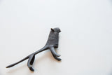 High-angle view of the vintage African lion collectible highlighting its dark patina.