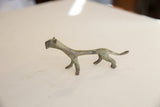 Side view of the vintage African lioness, detailing its slender form and oxidized finish.