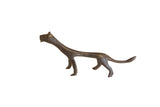 Vintage African cheetah sculpture with a stylized elongated body and dark patina.