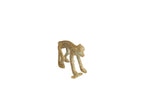 Vintage African bronze collectible of a monkey standing with a fish, showing rustic patina.