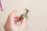 Aged greenish-bronze back and tail of the vintage African Ewe impala gold weight.
