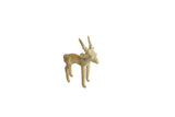 Vintage African impala ram gold weight with a weathered gold and green patina.