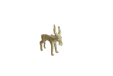 Vintage African bronze impala figurine with a textured, aged green patina.