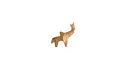 A small vintage African elephant carving with a rustic, weathered brown finish and raised trunk.
