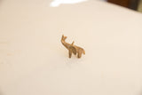 Side profile of a vintage African mini elephant showing its aged, rustic finish.