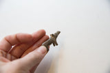 Vintage African mini hippo held in hand, showing its petite scale and side profile.