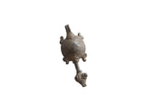 Vintage African turtle pendant with a dark, aged patina and an incised spiral shell.