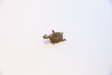 Full view of the small African turtle pendant showing its aged patina.