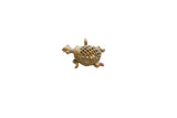 Vintage African turtle pendant with an oxidized finish and hollow lattice shell.