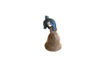 Vintage African bronze bell with a rustic, time-worn patina and a knotted blue fabric loop.