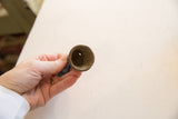 A look inside the hollow bronze bell revealing its aged, textured interior.
