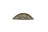 Vintage African handmade bronze shield featuring two spiral motifs and a textured rope border.