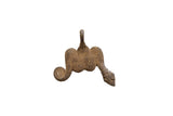 Vintage African bronze snake pendant with a textured, symmetrical body and coiled tail.