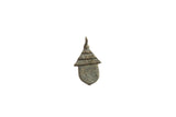 Vintage African bronze pendant designed as a hut with textured brick and thatched roof details.