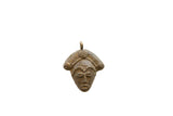 Vintage African bronze face pendant with a weathered, textured patina and a pirate-style hat.