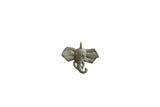 Vintage African elephant head pendant cast in bronze with an oxidized, textured patina.
