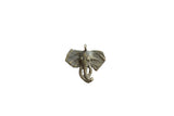 Vintage African bronze elephant head pendant with a textured surface and dark, aged patina.